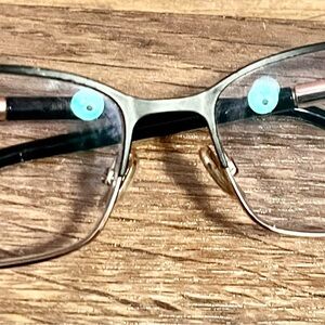 Jimmy Choo black and gold sparkly glasses. Quiet luxury. Sparkly. Collegiate.